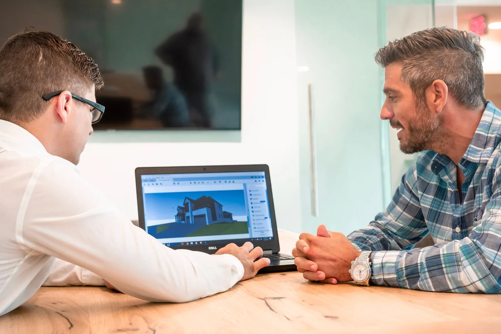 Business meeting using a laptop to schedule appointments