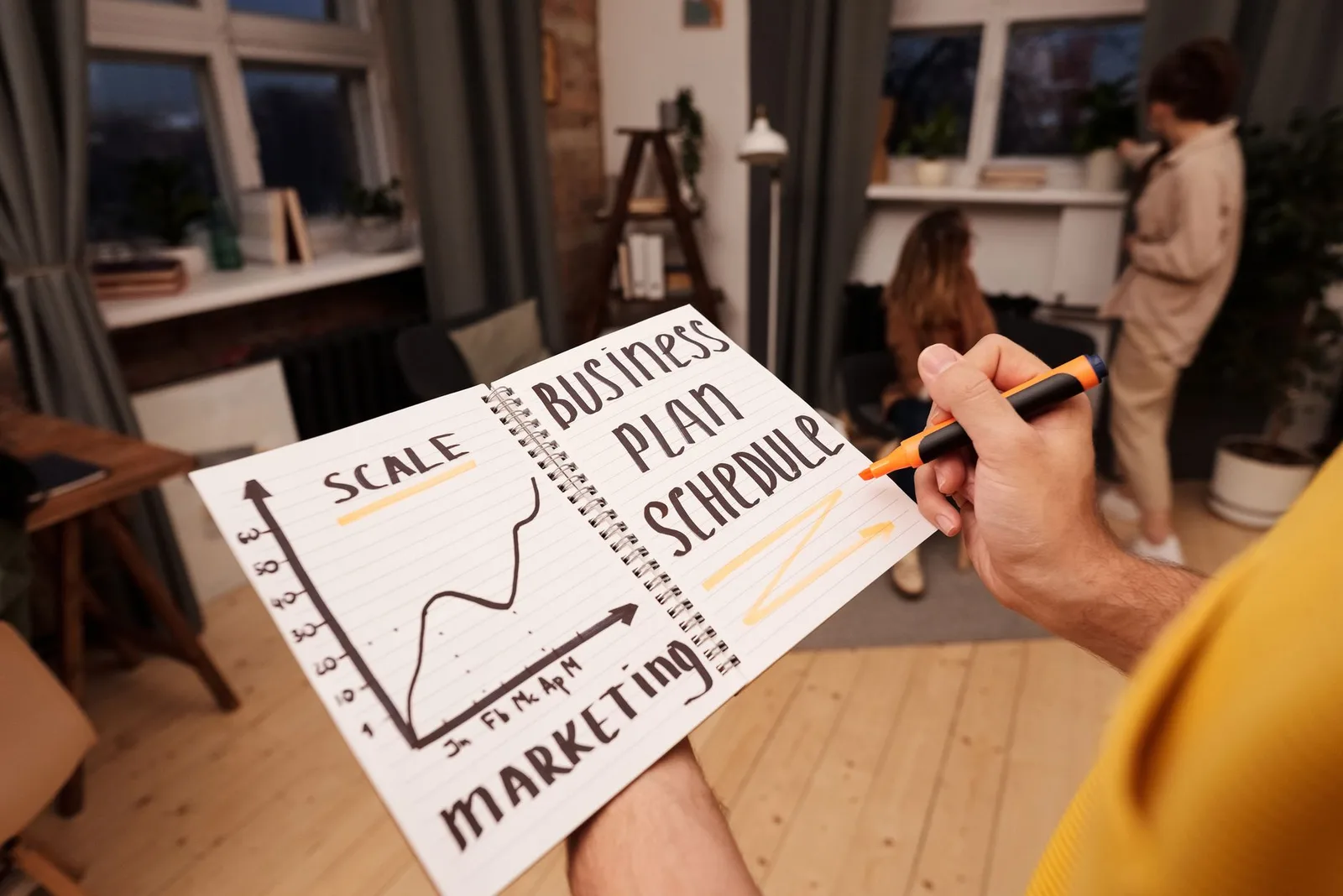 A business owner using a scheduling tool on a laptop