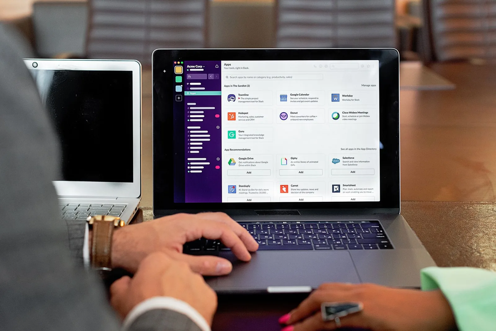 A professional using business management software on a laptop