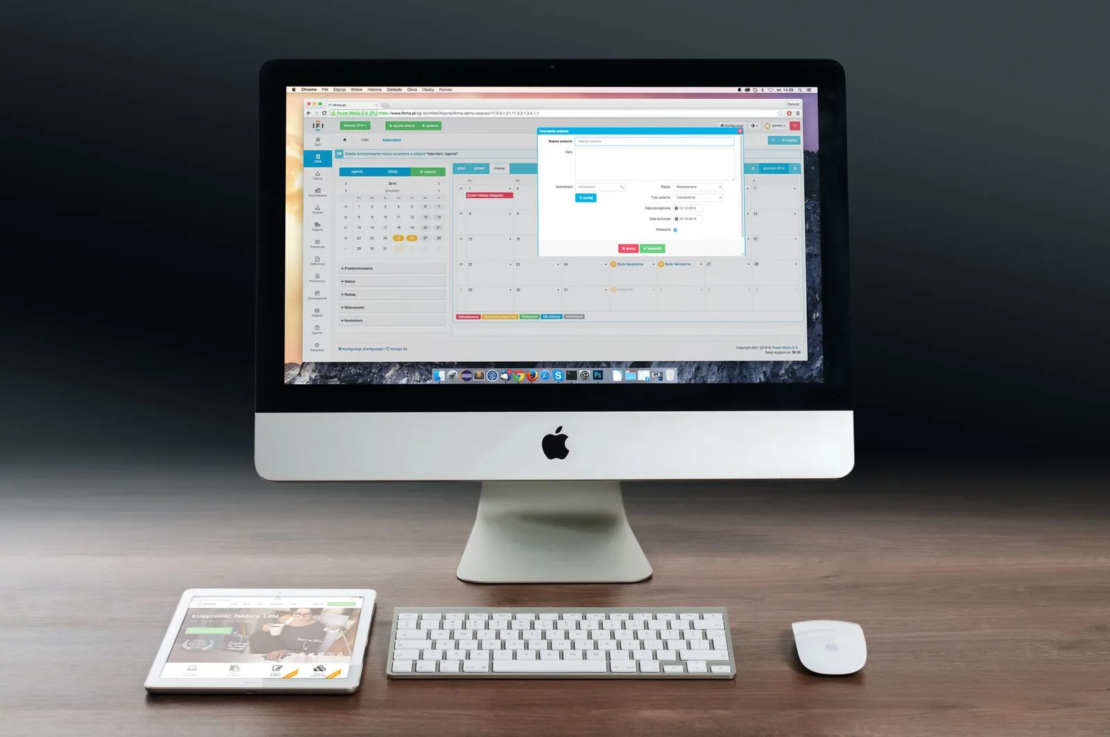 A professional using business management software on a laptop