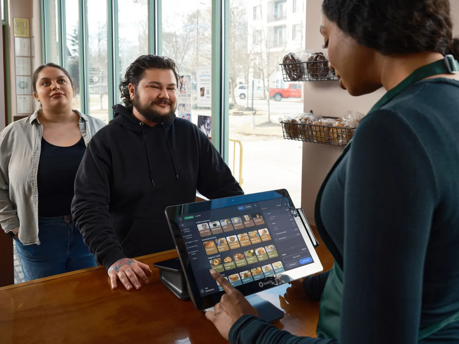 A professional using business management software on a laptop