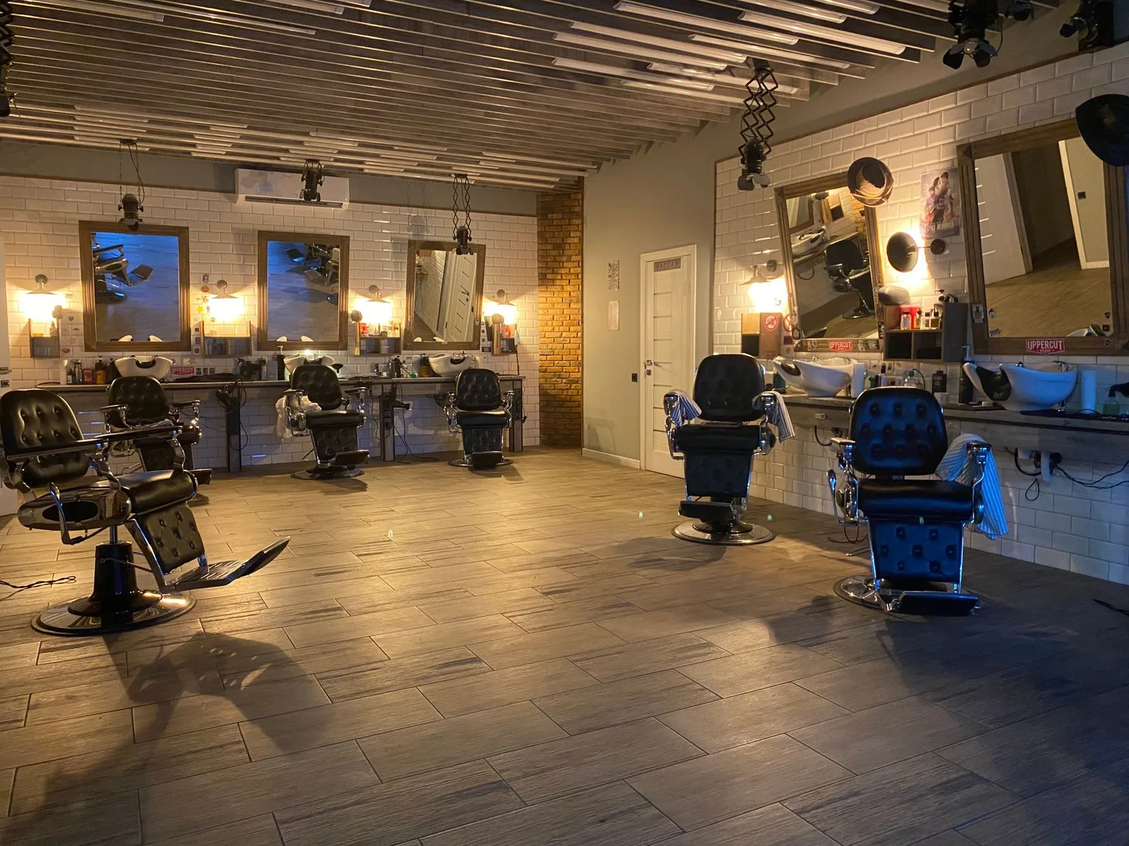 Interior of a modern hair salon with stylists at work
