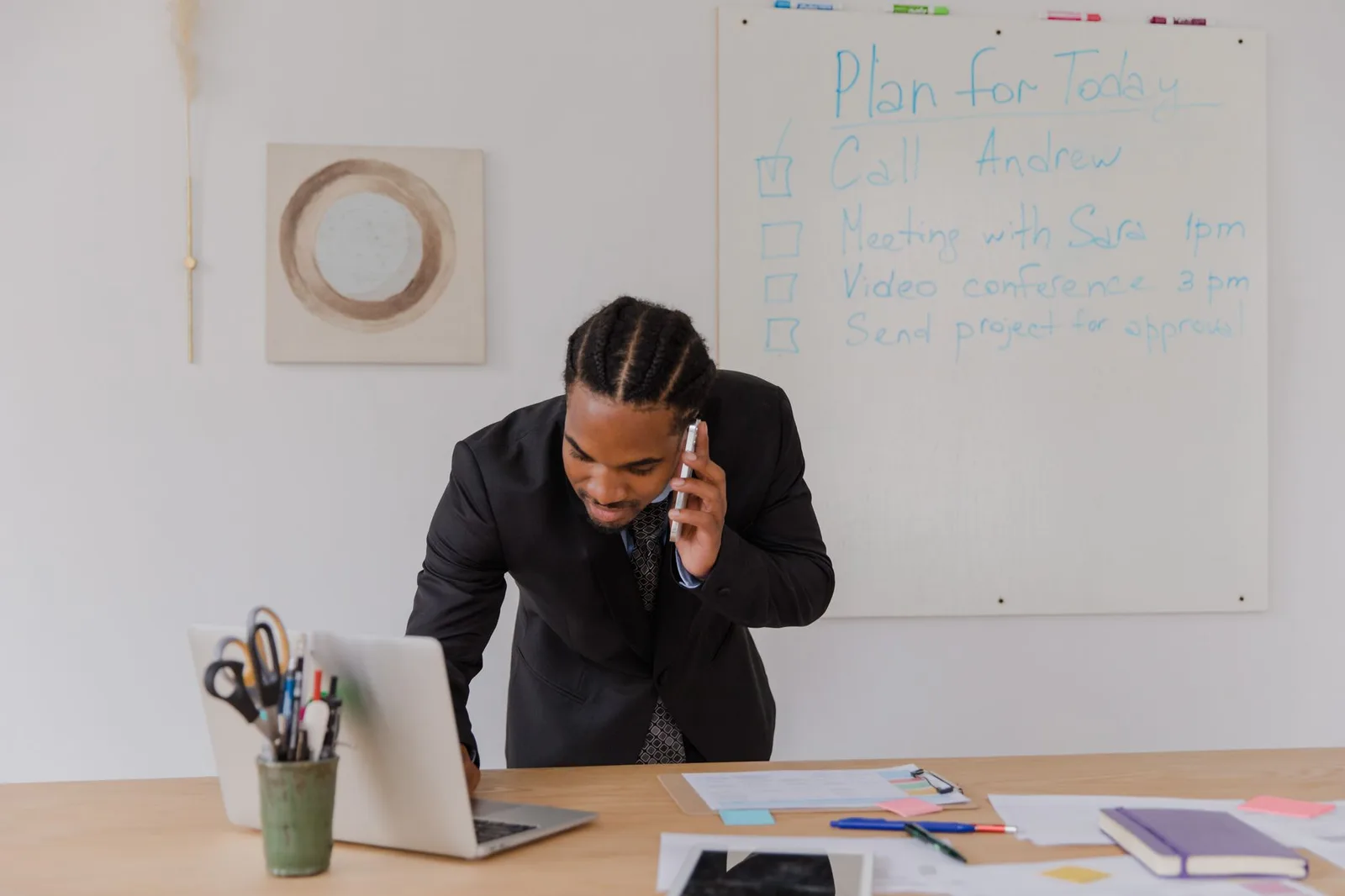 A business owner using a scheduling app on a tablet