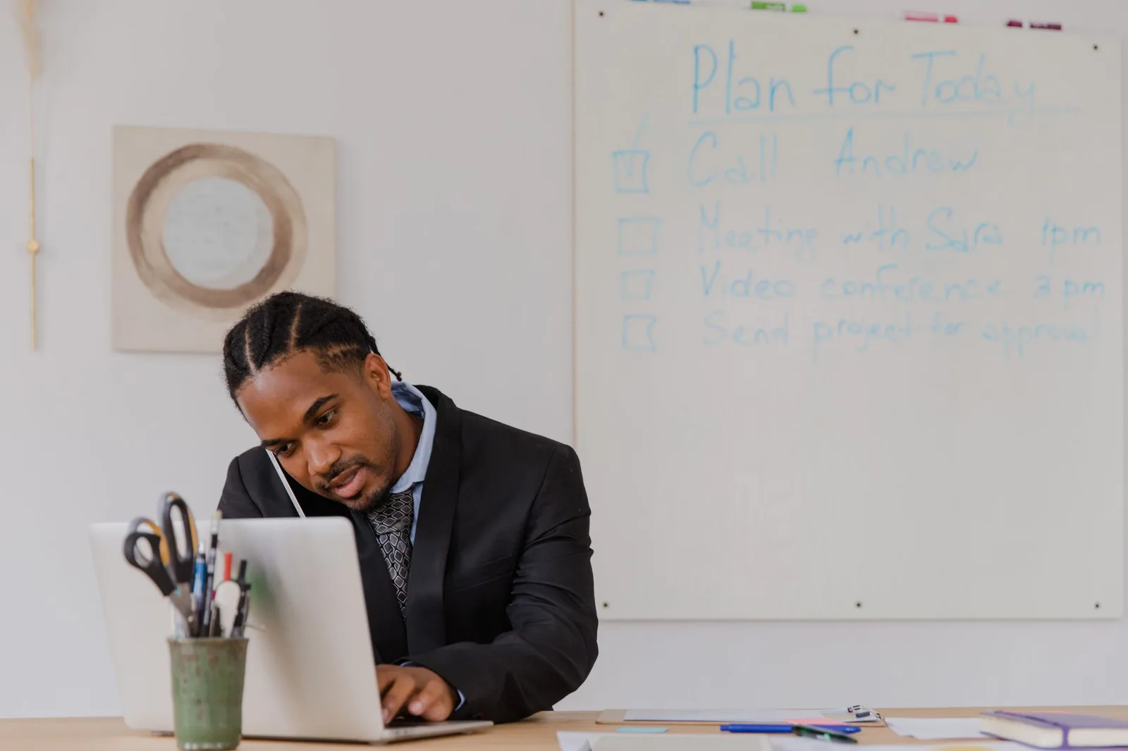 A business owner using a scheduling app on a tablet