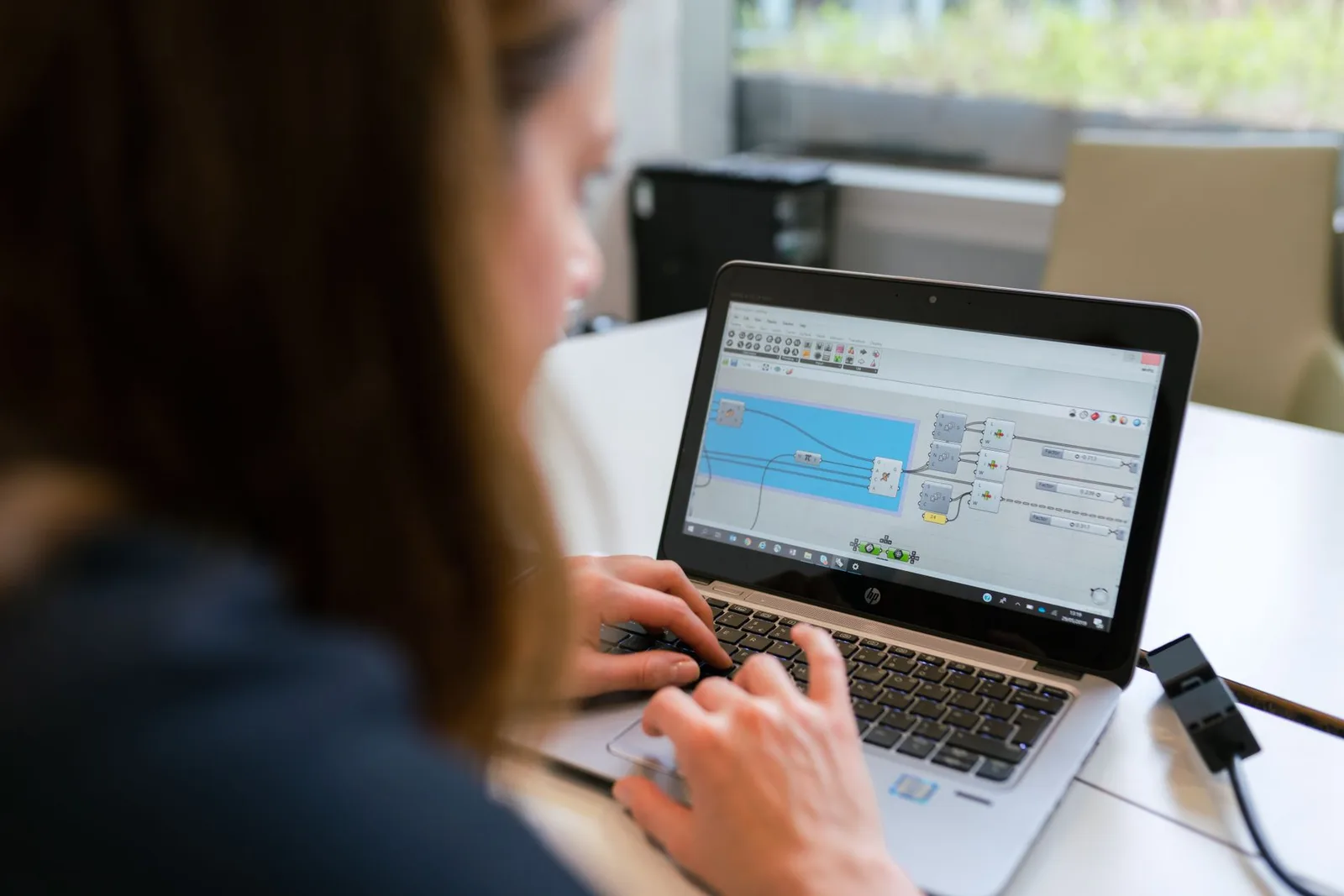 A professional using free online appointment setter software on a laptop