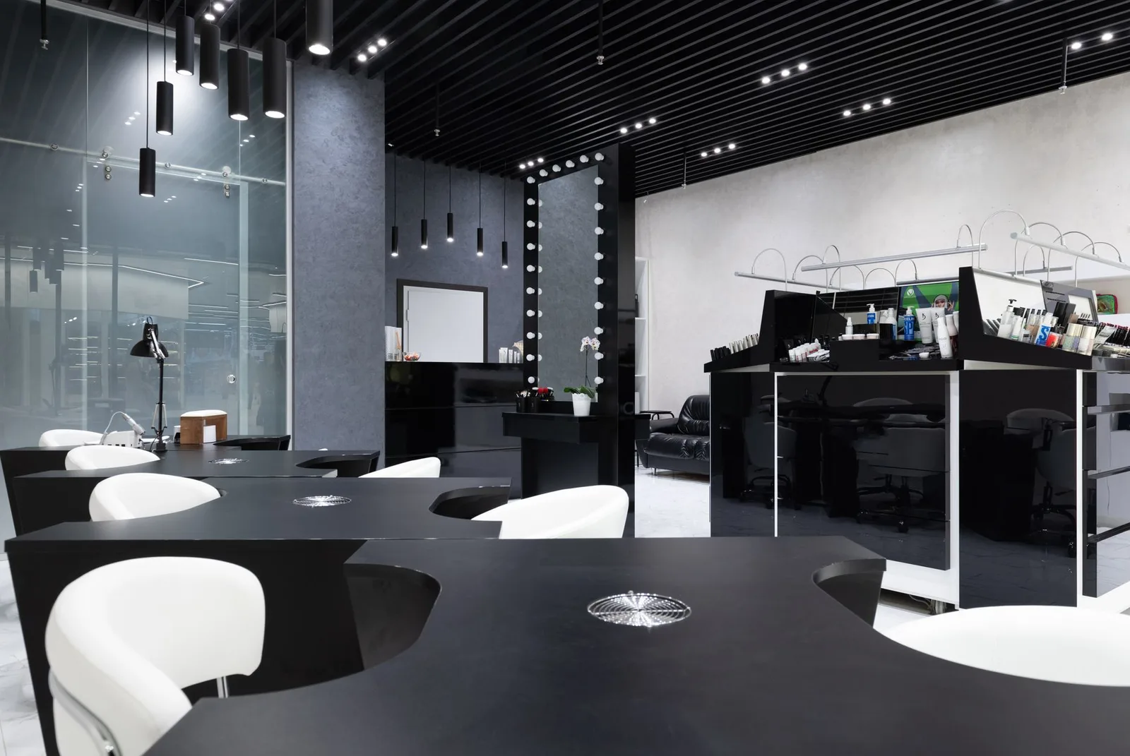 Modern nail salon interior with clients