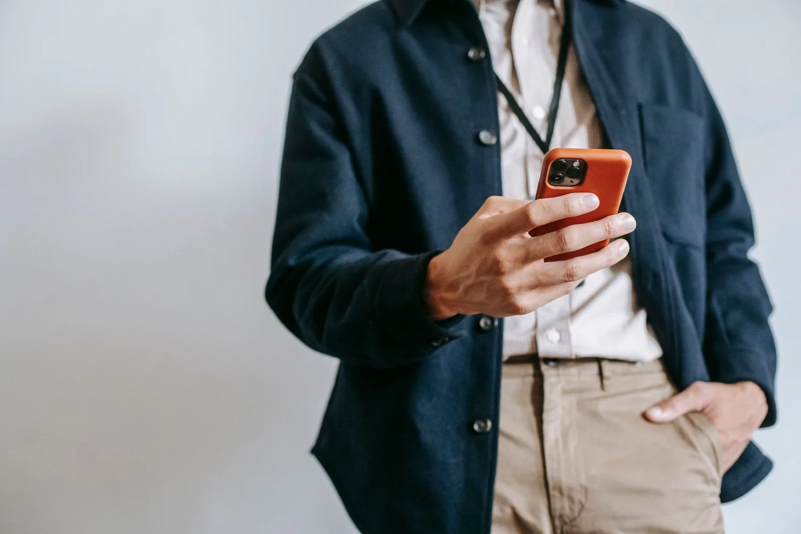 Business owner checking SMS reminders on phone