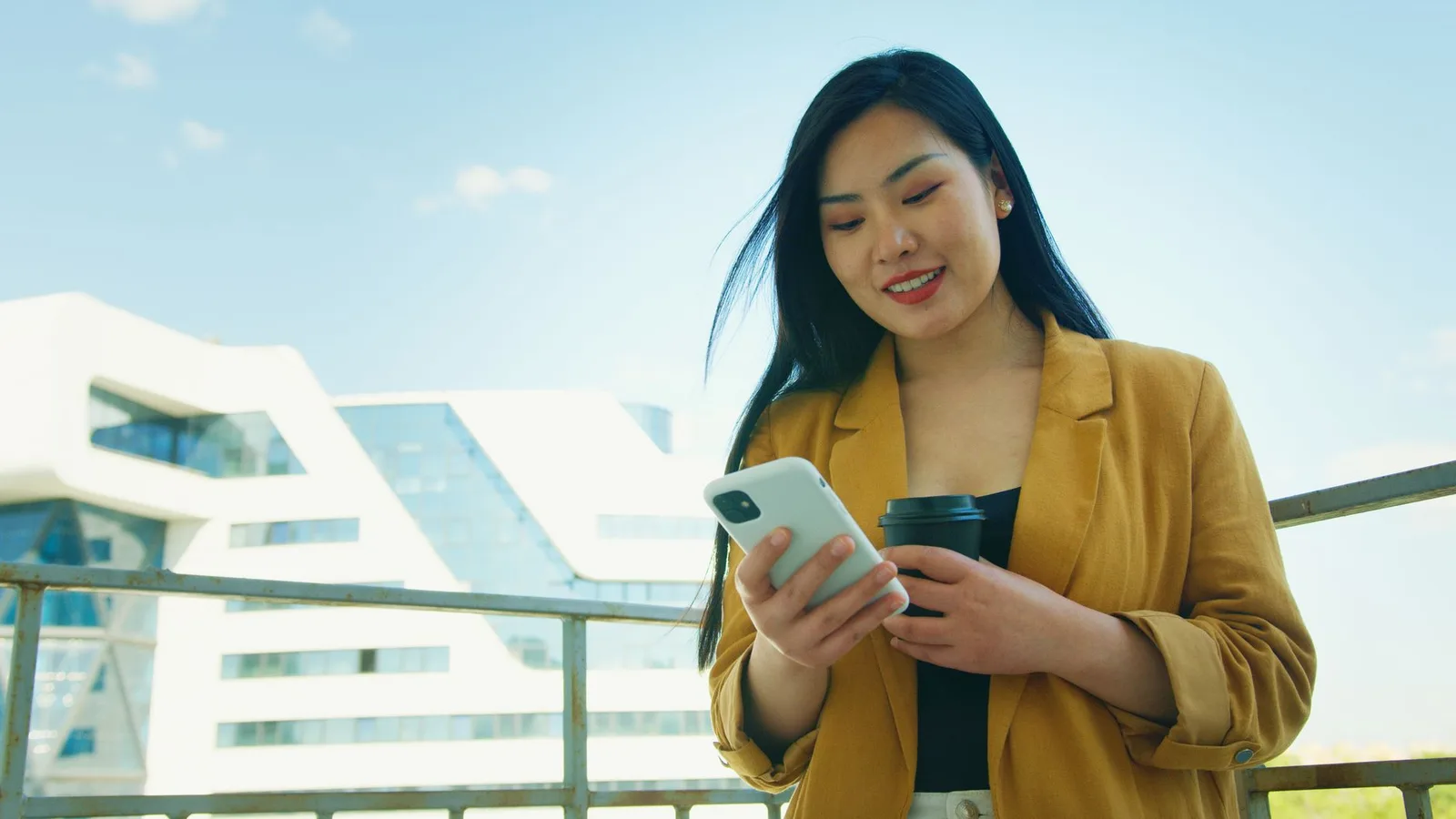 Business owner checking SMS reminders on phone