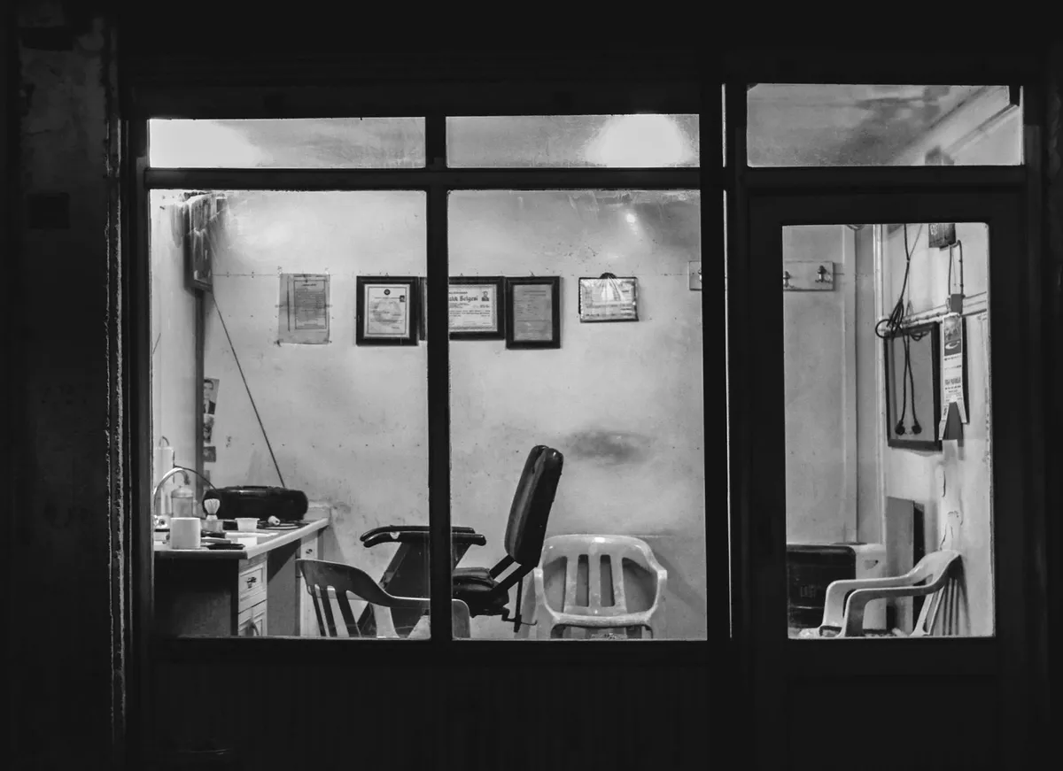 Empty barbershop seen through the window