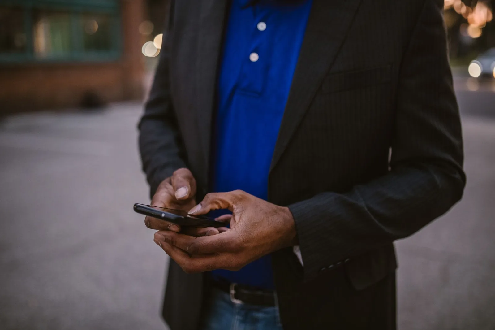 Person using a mobile phone to send appointment reminders