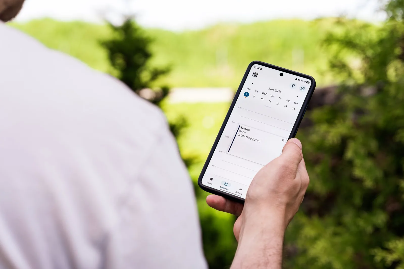 A business owner using a scheduling app on a tablet