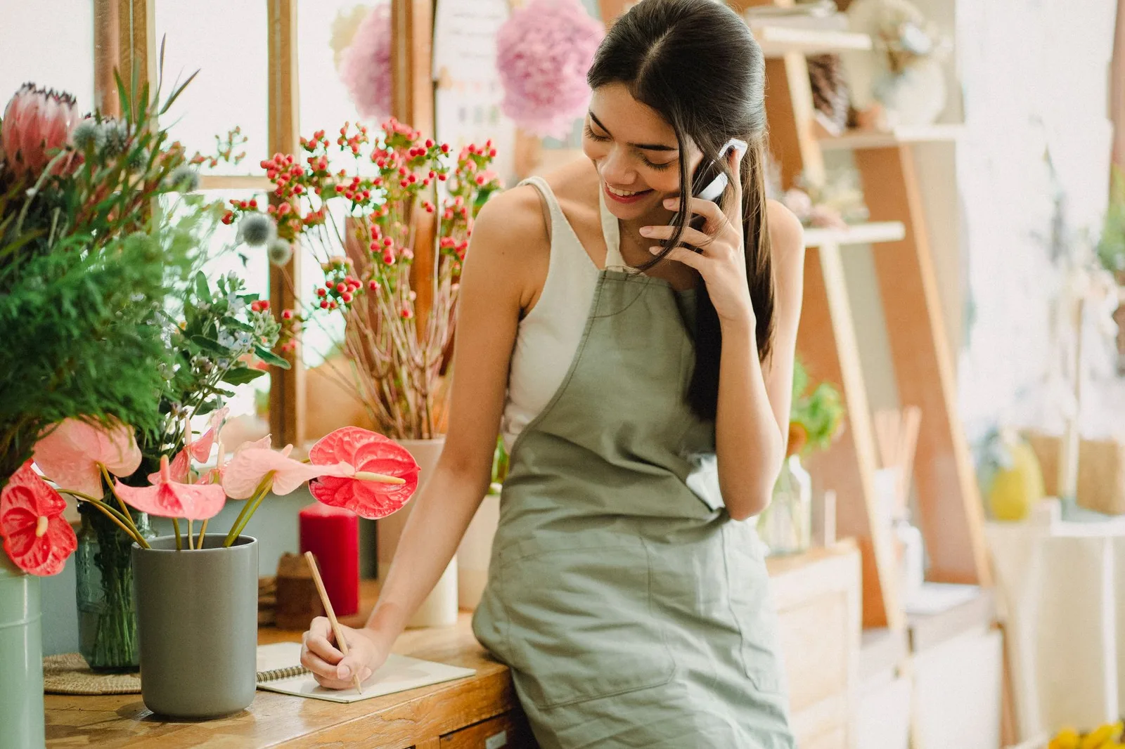 A business owner checking SMS reminders on their phone