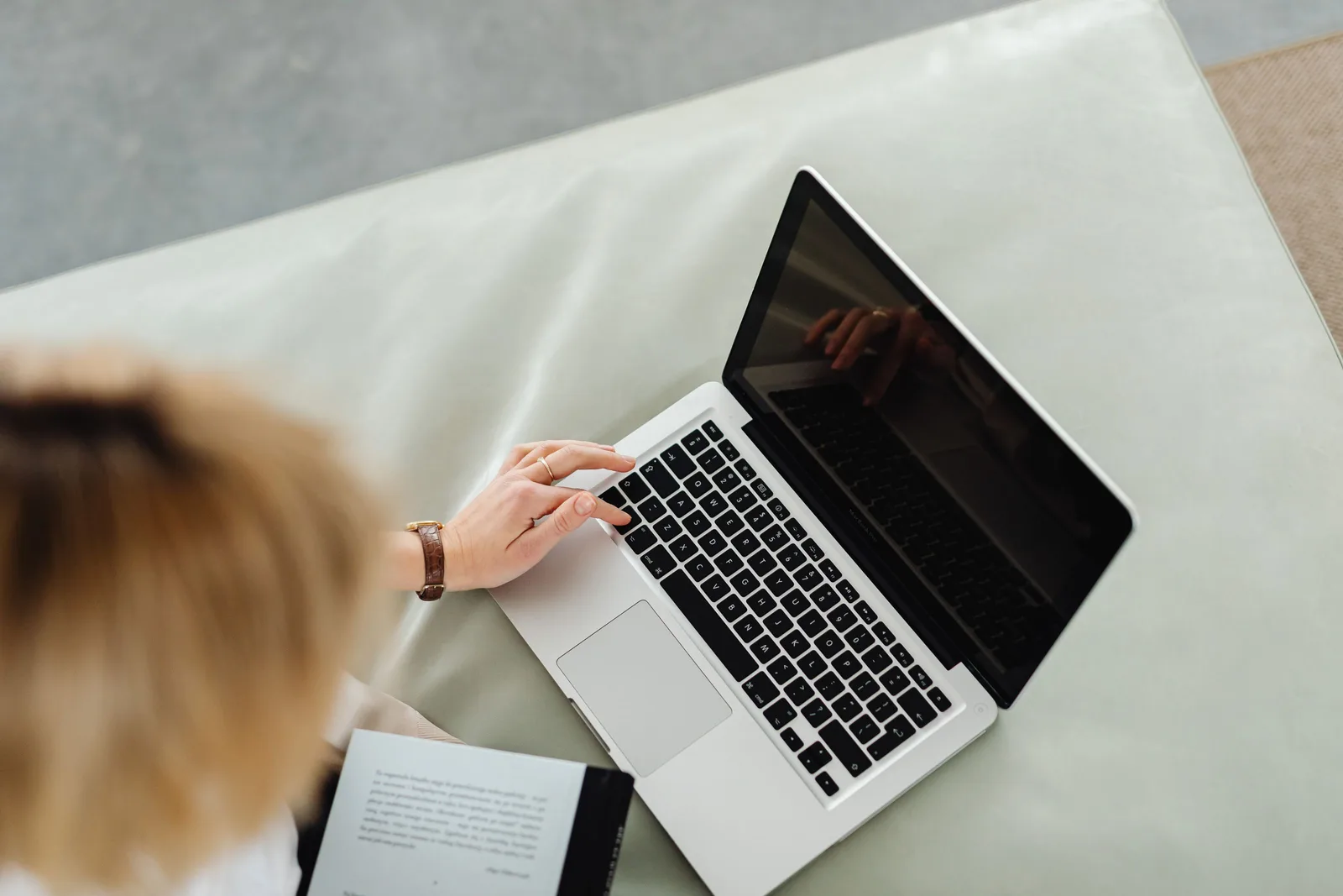 A client booking an appointment online from her laptop