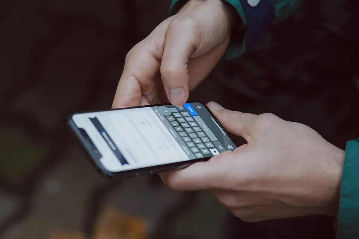 Person writing a text message on a smartphone