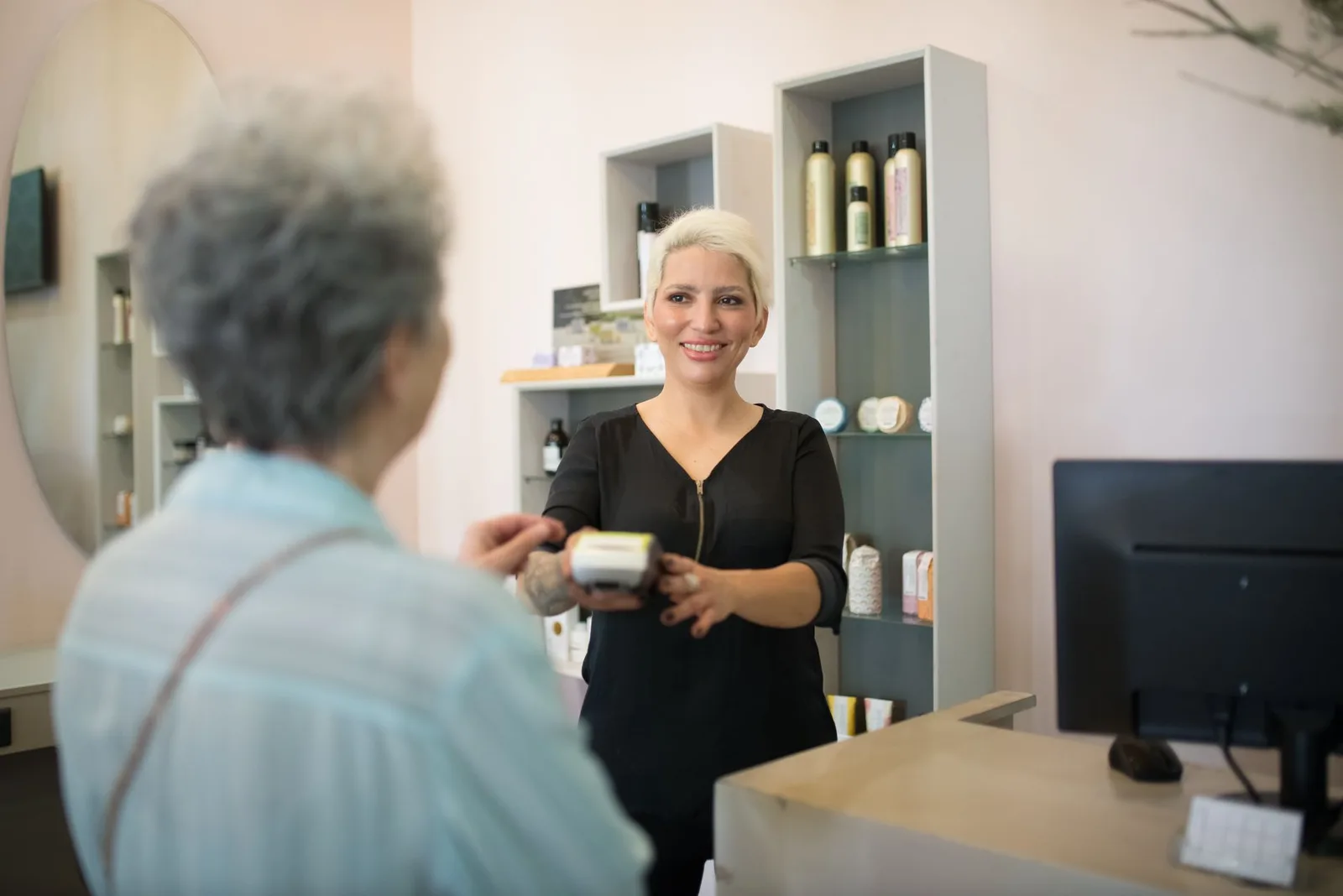 An inviting salon interior with a POS system at the counter