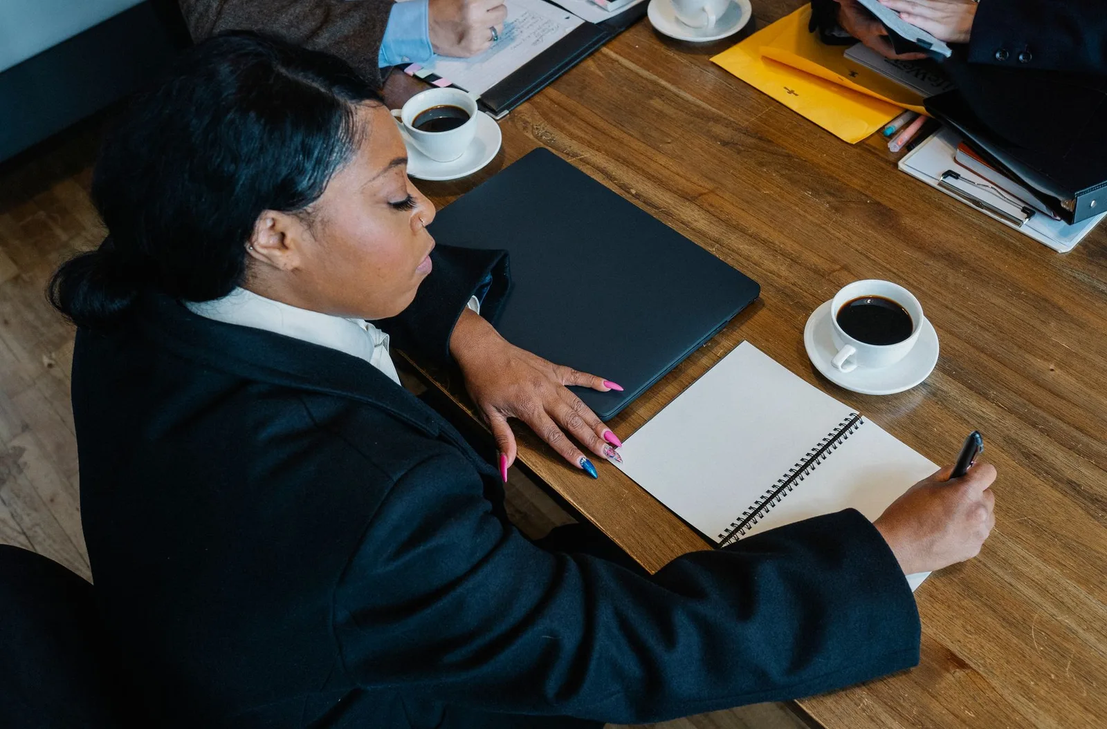 Business meeting discussing booking software