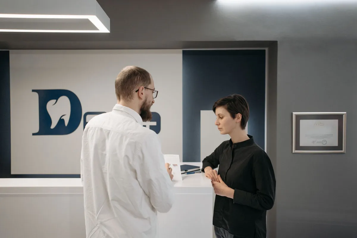Doctor talking with a patient at a clinic reception
