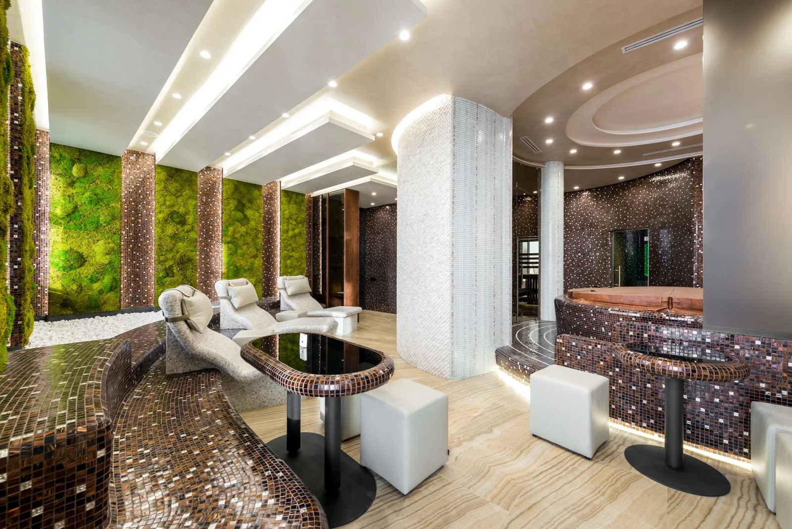 A serene spa interior with candles and a massage table