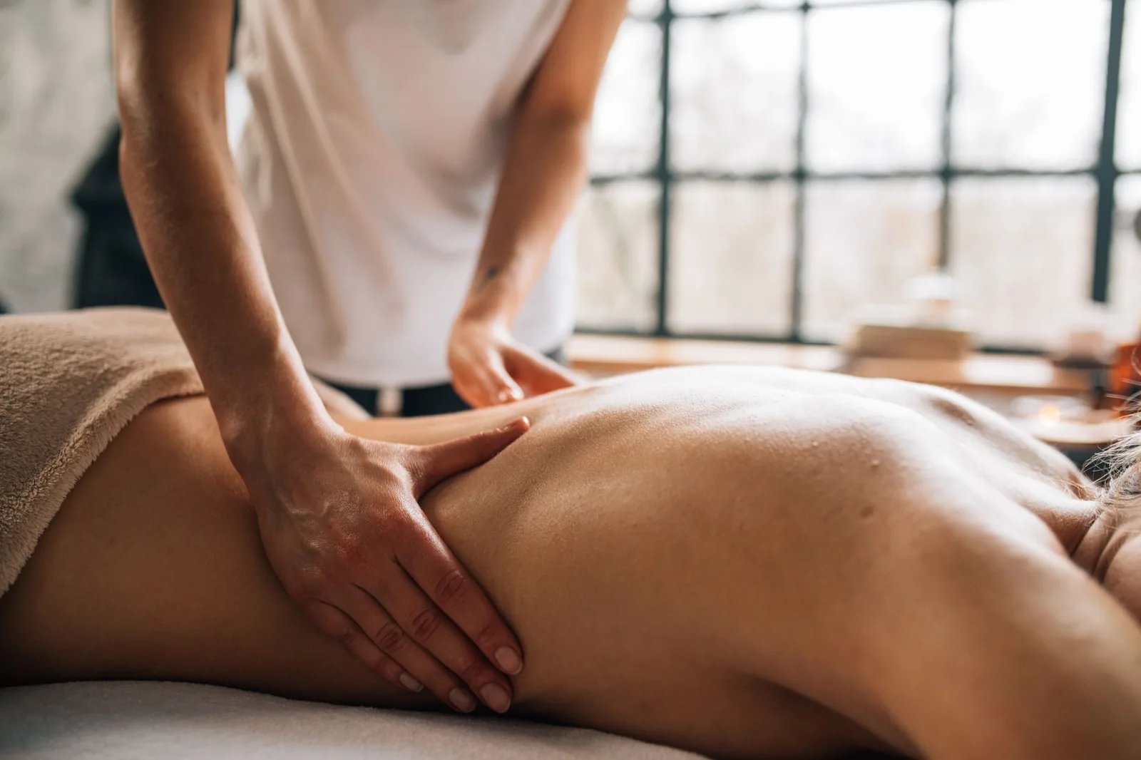 A massage therapy room with a comfortable table and soothing ambiance