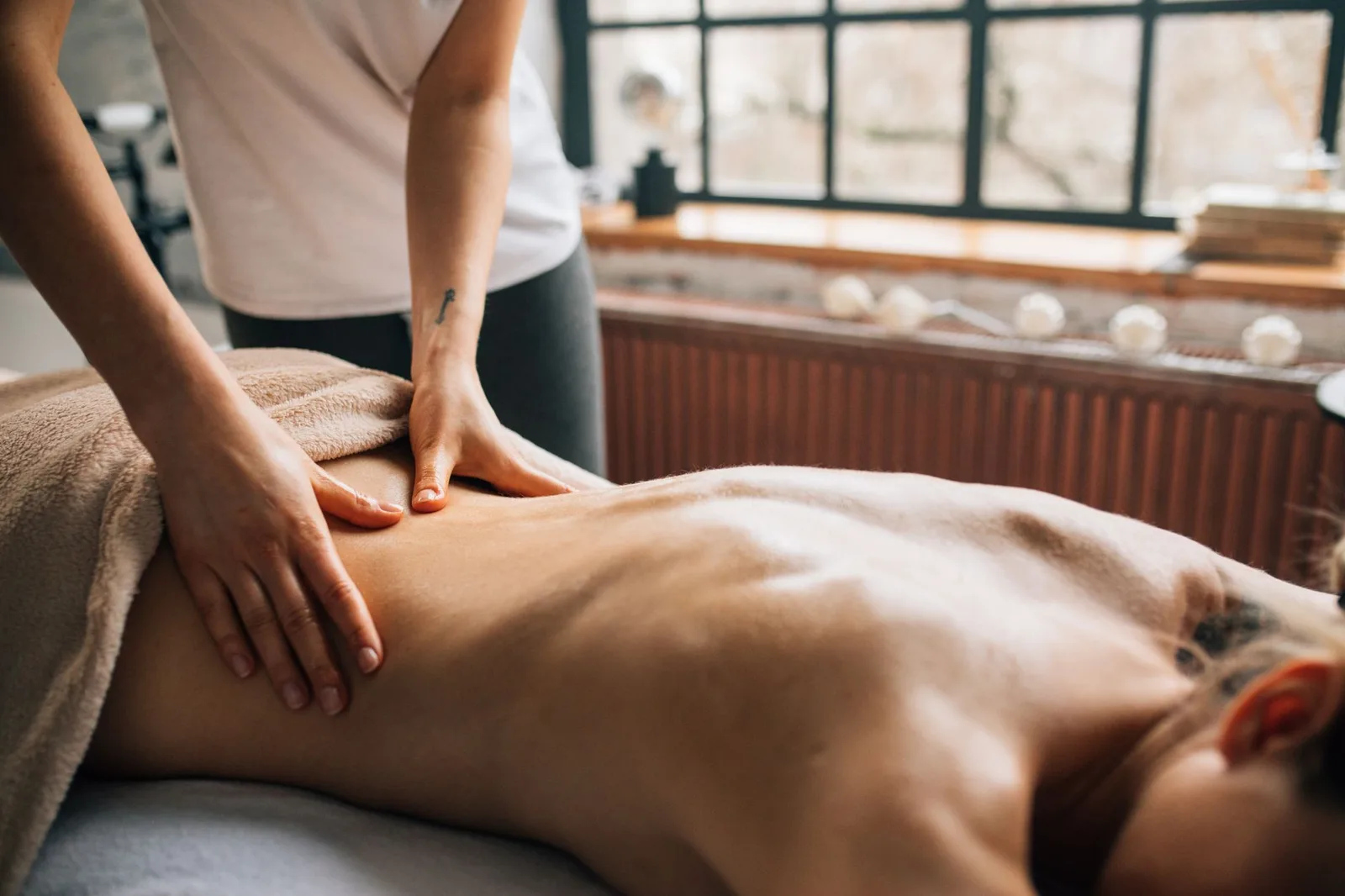 A massage therapy room with a comfortable table and soothing ambiance