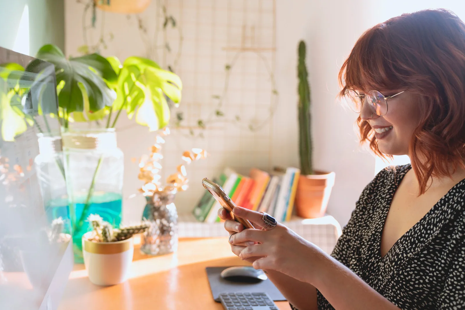A client booking an appointment online on her smartphone